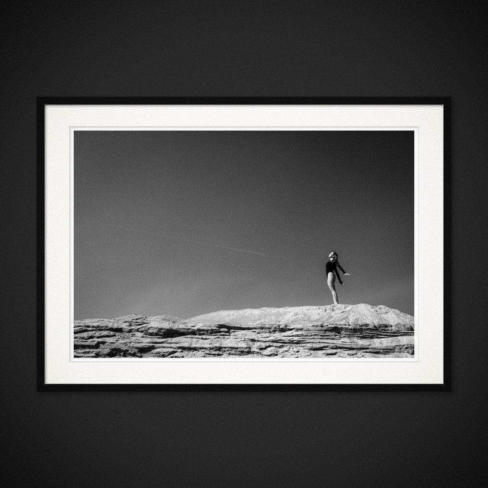 Beyond Determinism — A figure suspended above a bare ridge and an open sky. Framing preview by Albert Pocej; frame not included.